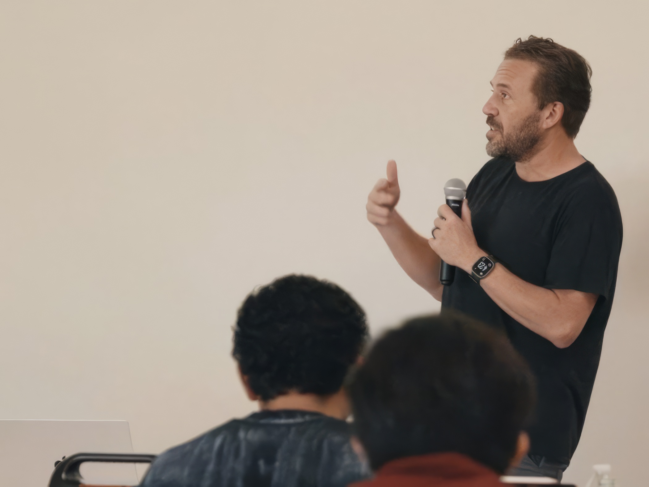 Speaker presenting to an audience during lightning talks